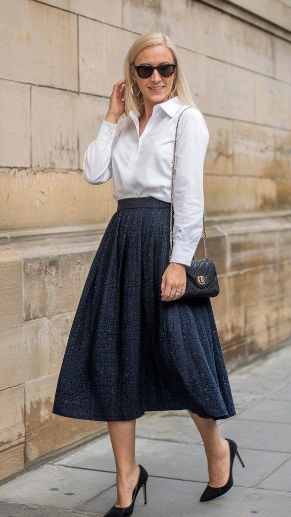 A Classic White Shirt With a Navy Pleated Midi Skirt