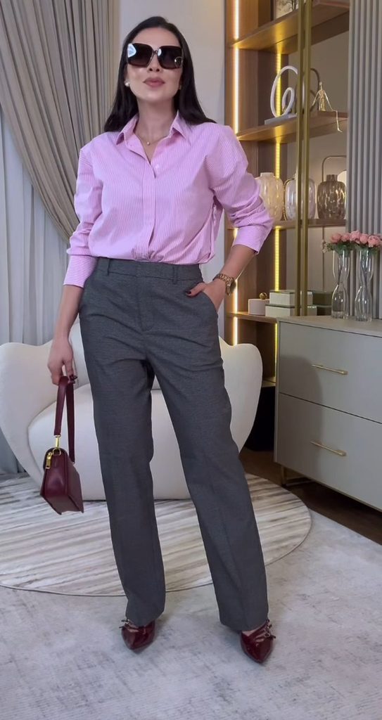  A Soft Pink Blouse With Grey Trousers