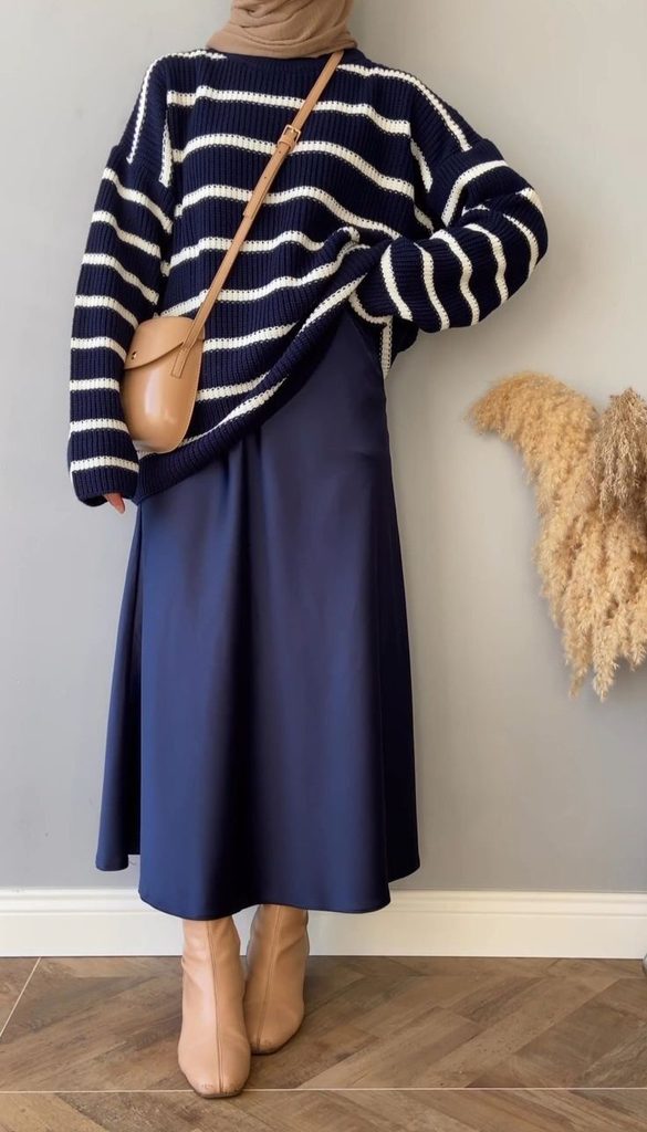 A Striped Knit Sweater With a Navy Midi Skirt